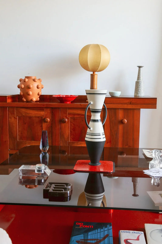 a modern interior decorated with mid century italian pieces