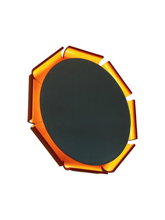 A round backlit wall mirror with a timber frame, illuminated by a fluorescent tube light, creating a soft glow around the mirror's edge by ISA Bergamo