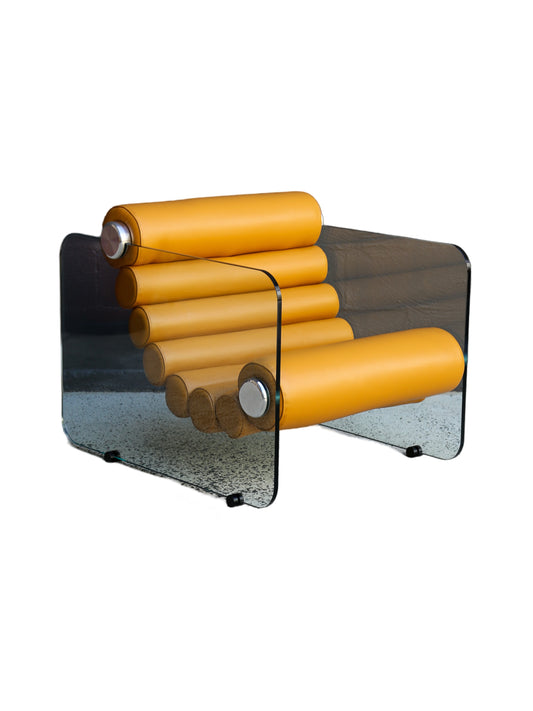 A mid-century modern armchair with mustard yellow leather rolls and a glass frame structure, designed by Fabio Lenci for Standing Italy.