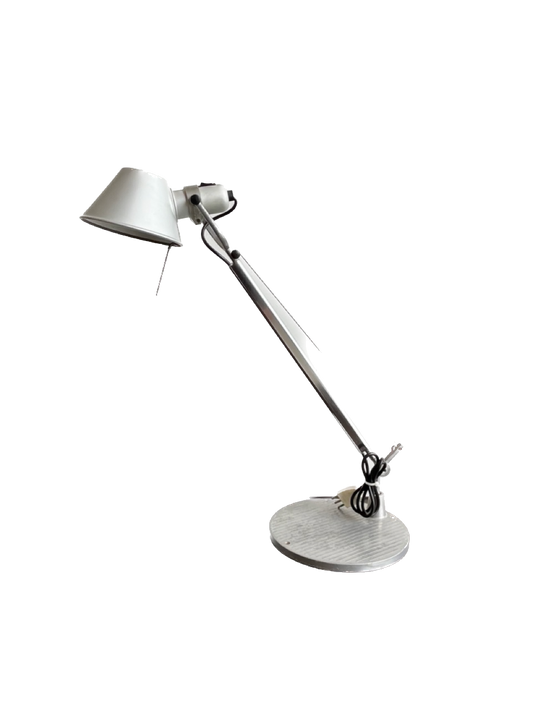 A silver Tolomeo Mini table lamp by Michele De Lucchi & Giancarlo Fassina for Artemide, featuring a retractable and adjustable arm.