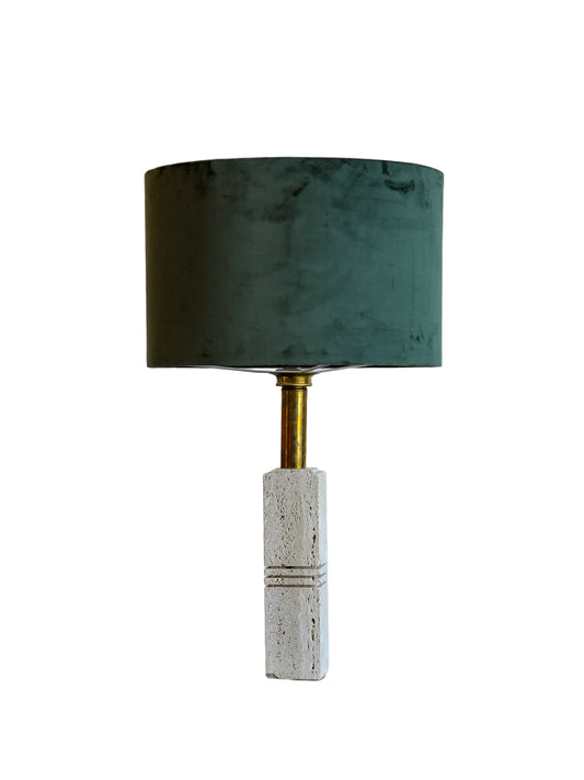 A table lamp with a deep green velvet drum shade, a white travertine stone base, and a warm brass-finished stem by Fratelli Mannelli