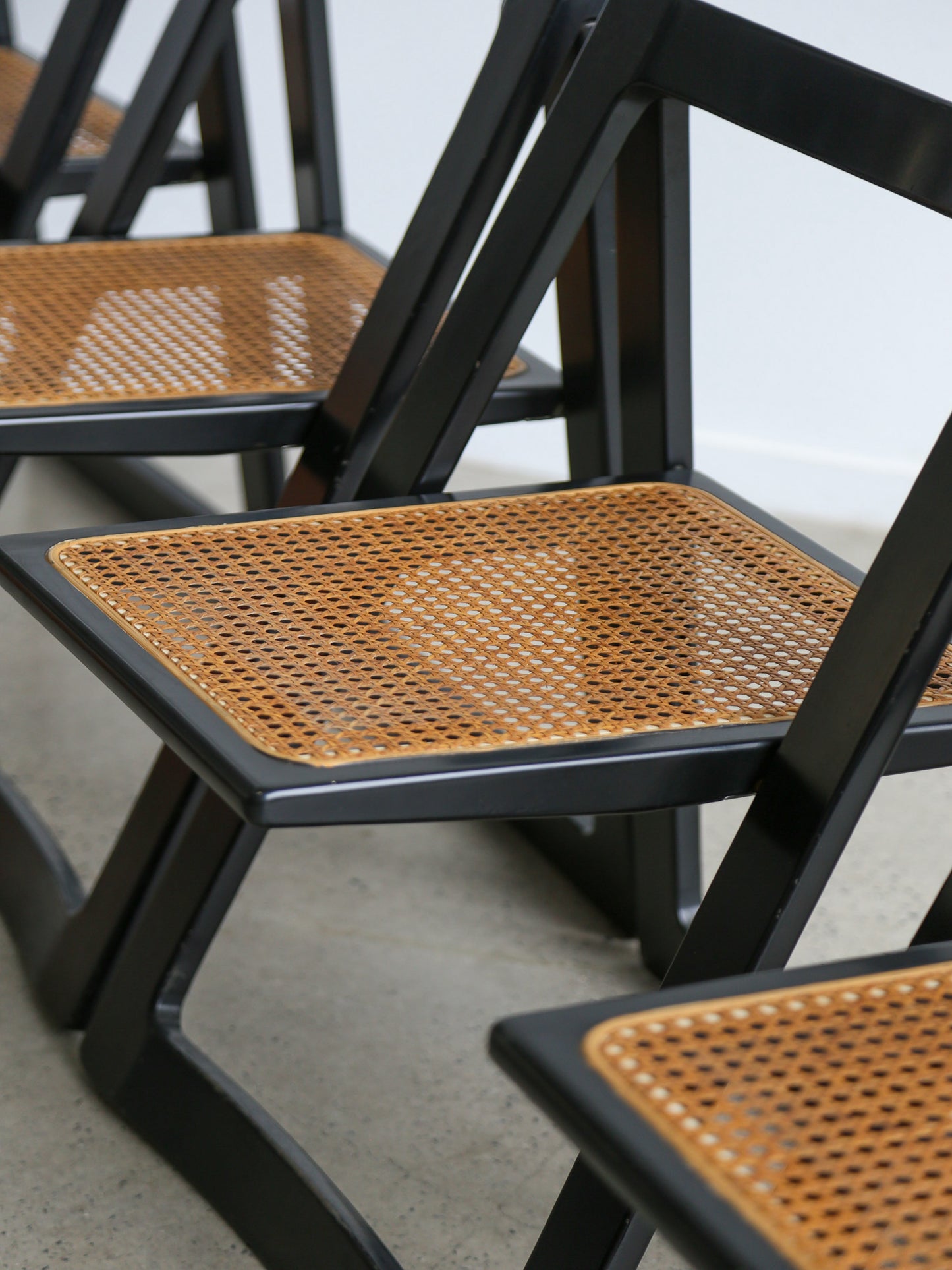 Detail of woven Vienna straw seats on Aldo Jacober folding chairs for Bazzani, Italy, 1960s