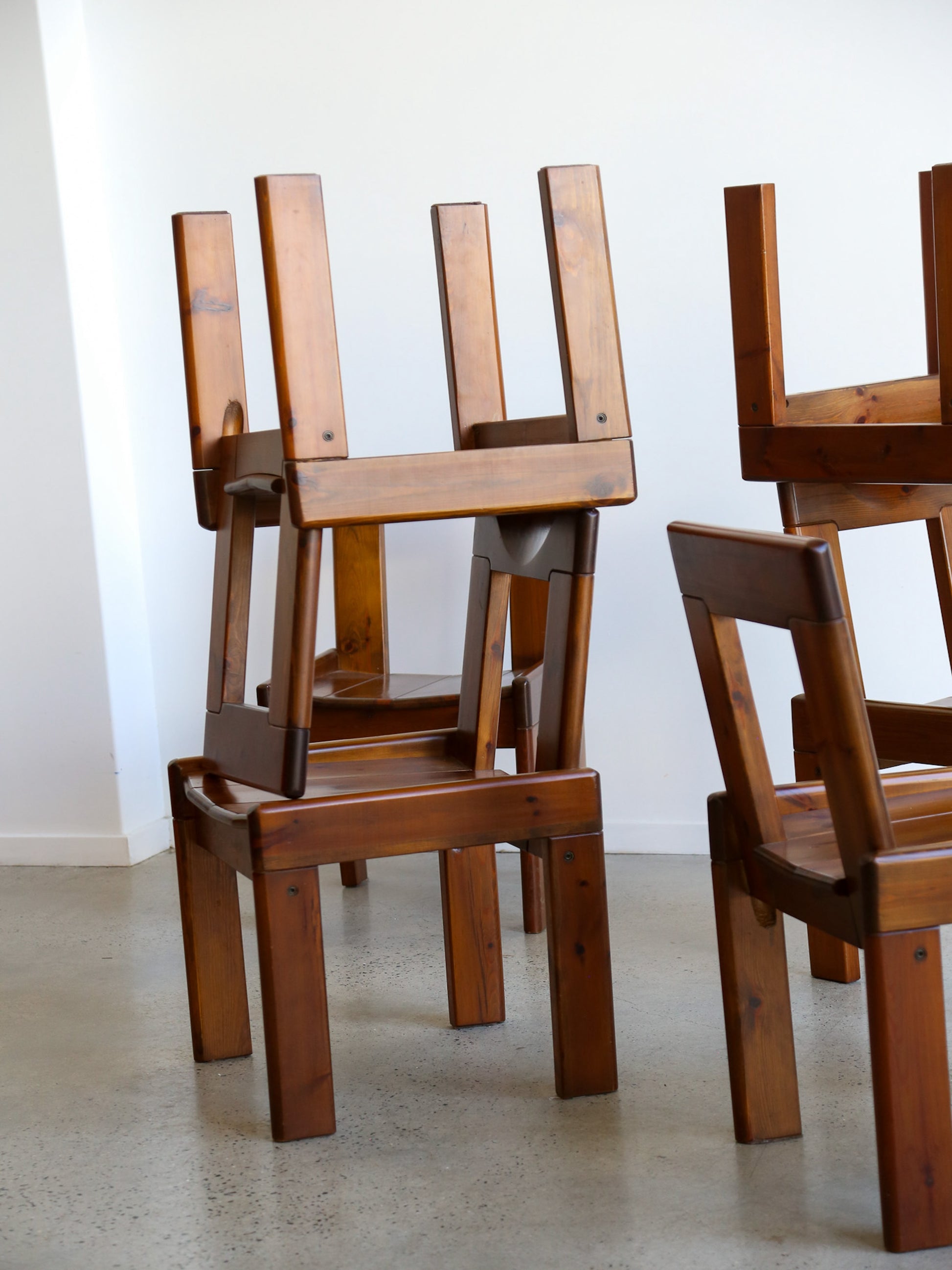 Stacked Italian pine dining chairs, Silvio Coppola mid-century modern design, 1970s