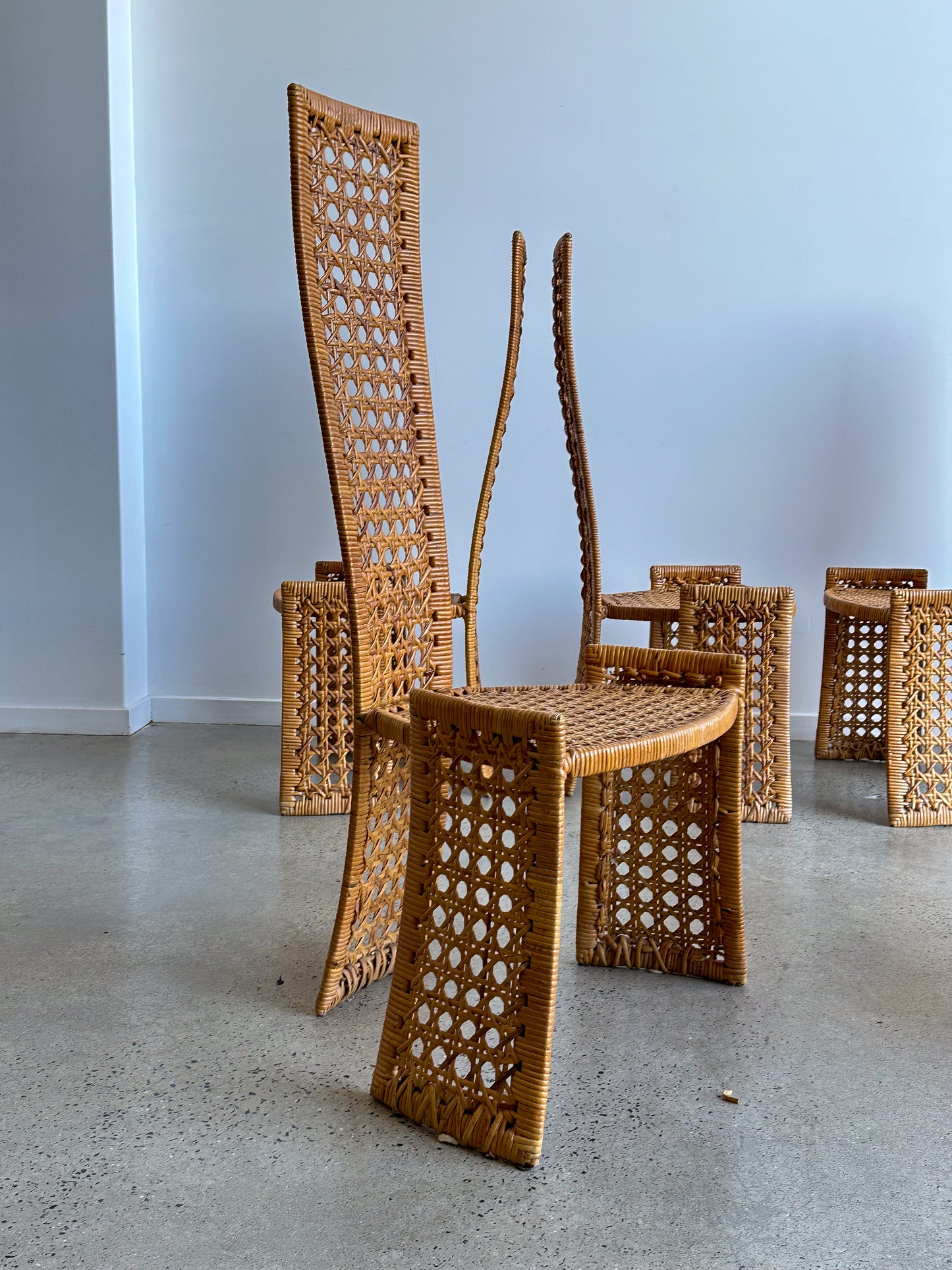 Side view of sculptural high-back rattan chair, Danny Ho Fong for Tropi-cal, mid-century modern