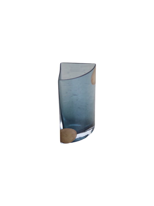 A blue smoked glass vase with silver accents, standing upright against a white background.