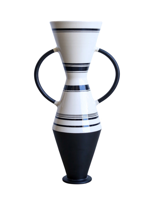A conical, spheroidal black and white striped ceramic vase with a matte finish and clay handles by Ugo La Pietra for Rometti