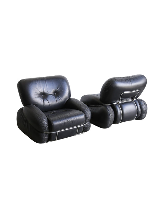 A set of Okay vintage black leather and chrome armchairs with a three-seater sofa and two armchairs, featuring a Space Age design by Adriano Piazzesi