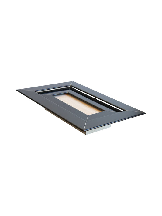 A rectangular black lacquered coffee table with a travertine base, designed by Paolo Piva for B&B Italia.