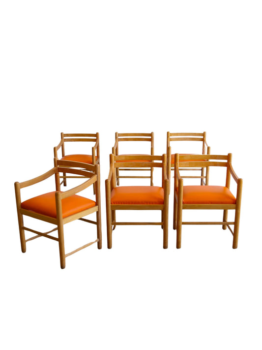 Set of six rosewood dining armchairs with orange leather seats, Italy 1960s Mid Century Modern design.
