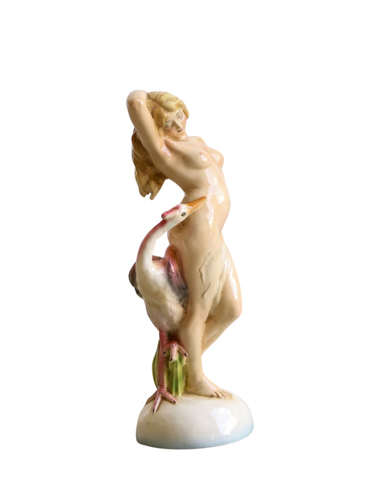 Hand painted ceramic sculpture of a nude woman with a bird on her shoulder, reflecting Mid Century Modern style.