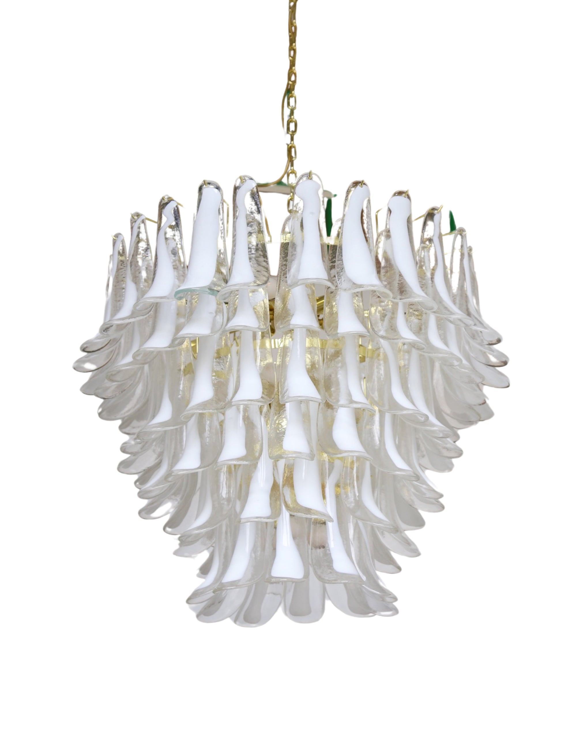 A Murano glass chandelier with a gold-coated metal frame, featuring multiple levels of glass saddles and internal light bulbs, hangs from a gold chain.