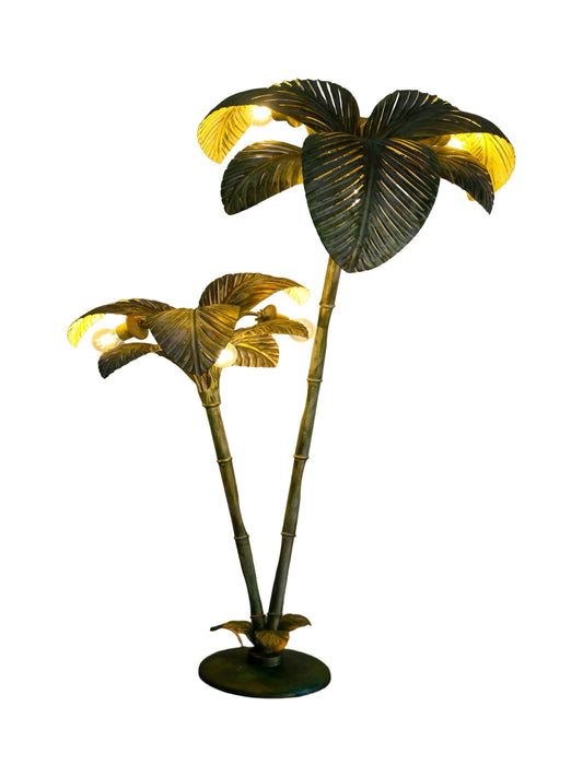 A brass floor lamp featuring a palm tree design with a circular base by Sergio Terzani