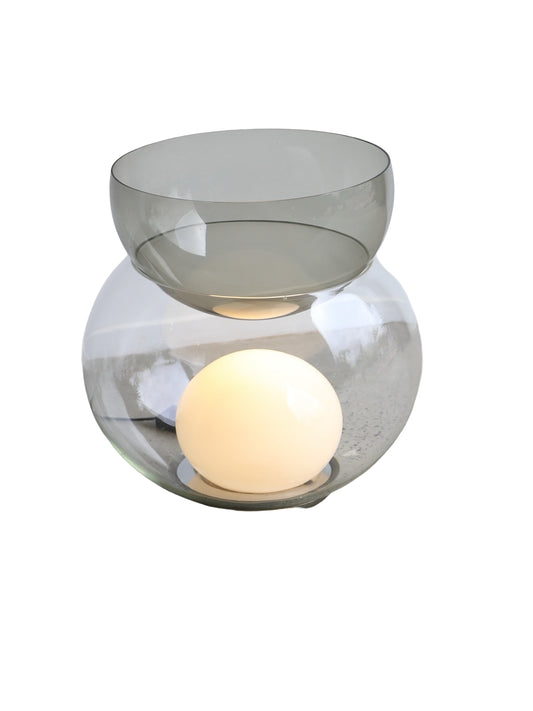 A Giova table lamp by Gae Aulenti for Fontana Arte featuring a spherical opaline glass light source hidden within a larger smokey glass half-sphere.