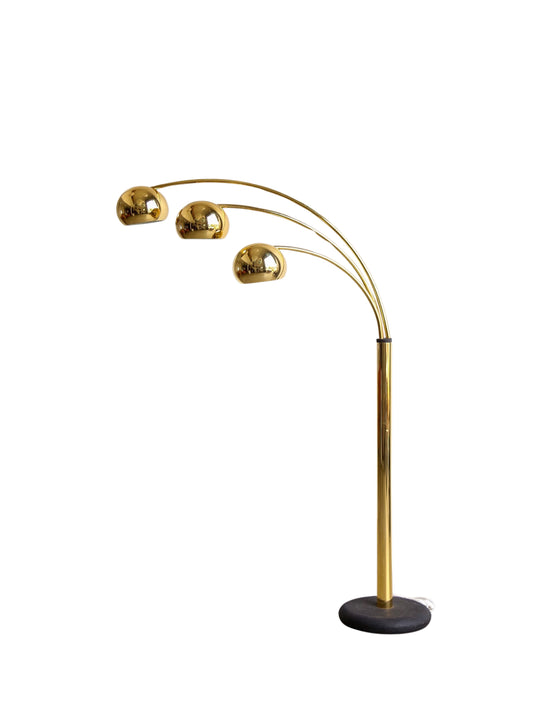 A vintage Italian swiving brass floor lamp with gilded metal and painted cast iron base, designed by Goffredo Reggiani in the 1970s.