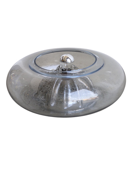 A Tony Zuccheri Vulcano Chrome & Murano Glass Table Lamp with a round chrome base and a Murano glass lampshade.