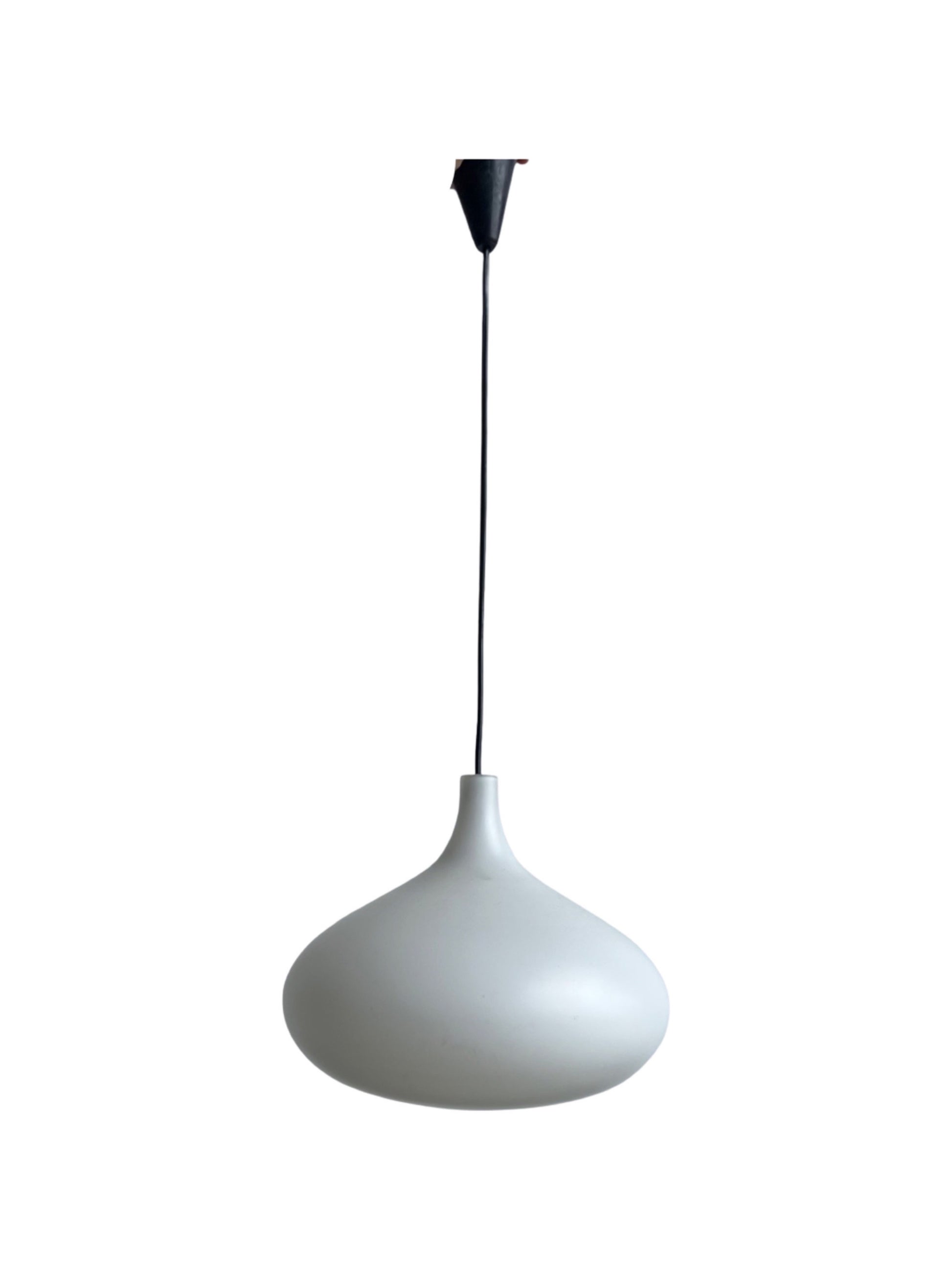 A white glass pendant light with a sleek and minimalist design, suspended by a black cord.