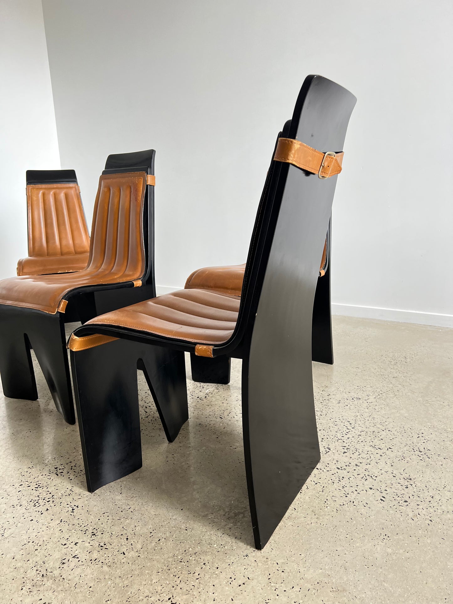 “Italian Mid Century Modern dining chair in black lacquer and leather”