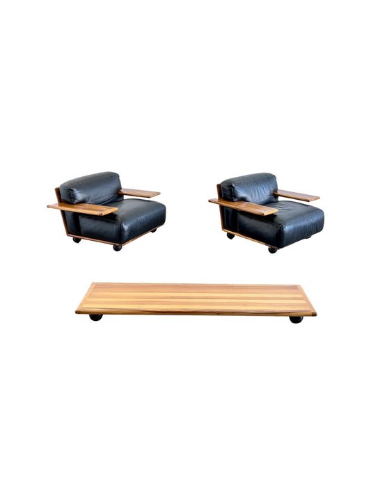 1970s Italian Pianura armchairs and coffee table by Mario Bellini for Cassina, walnut frames with black leather cushions.