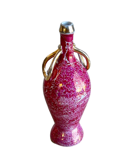A light purple, translucent Limoges porcelain vase with intricate floral patterns and a gold-colored handle.