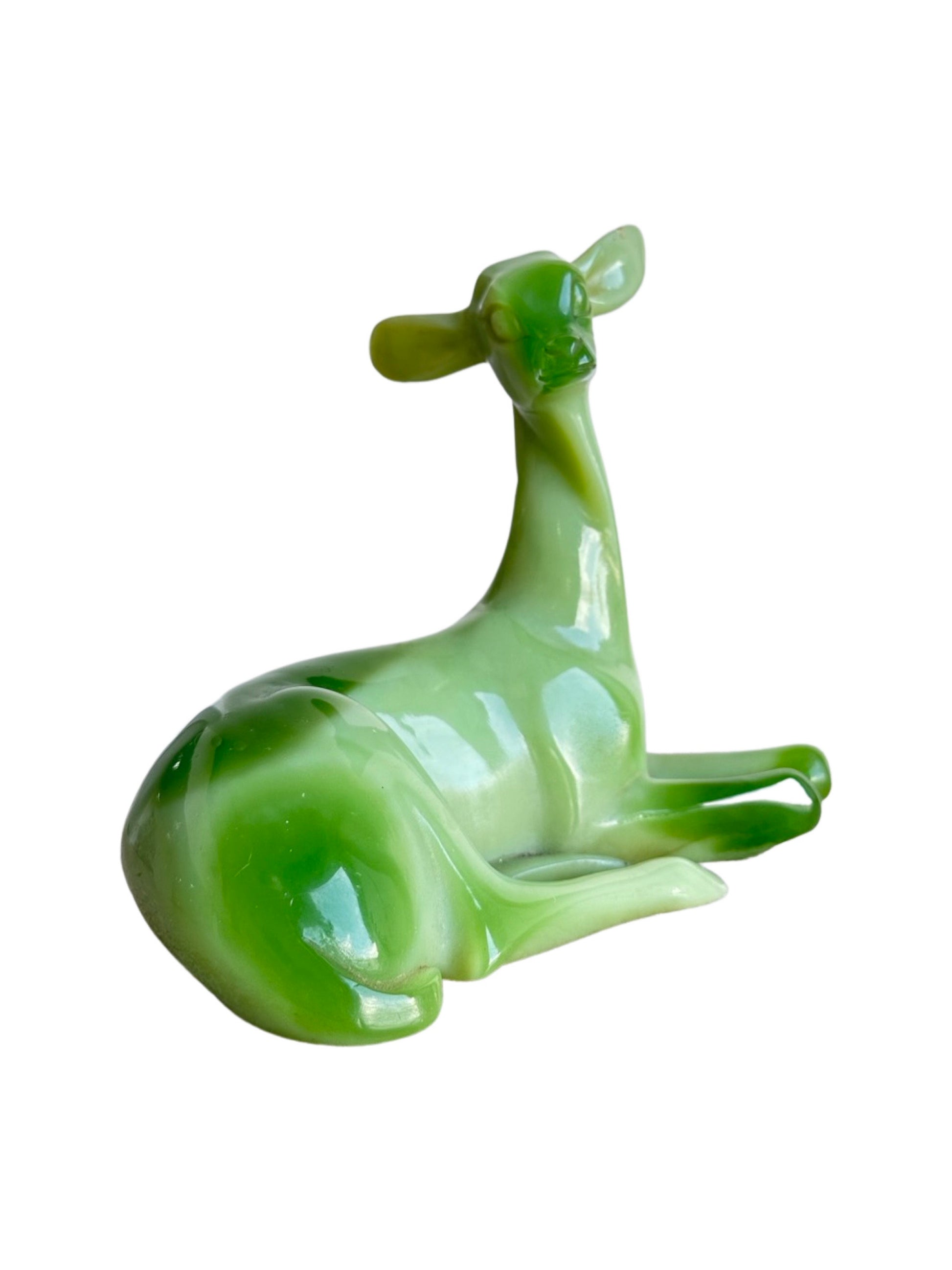 A green resin animal table sculpture by G.Ruggeri, depicting a reclining deer.