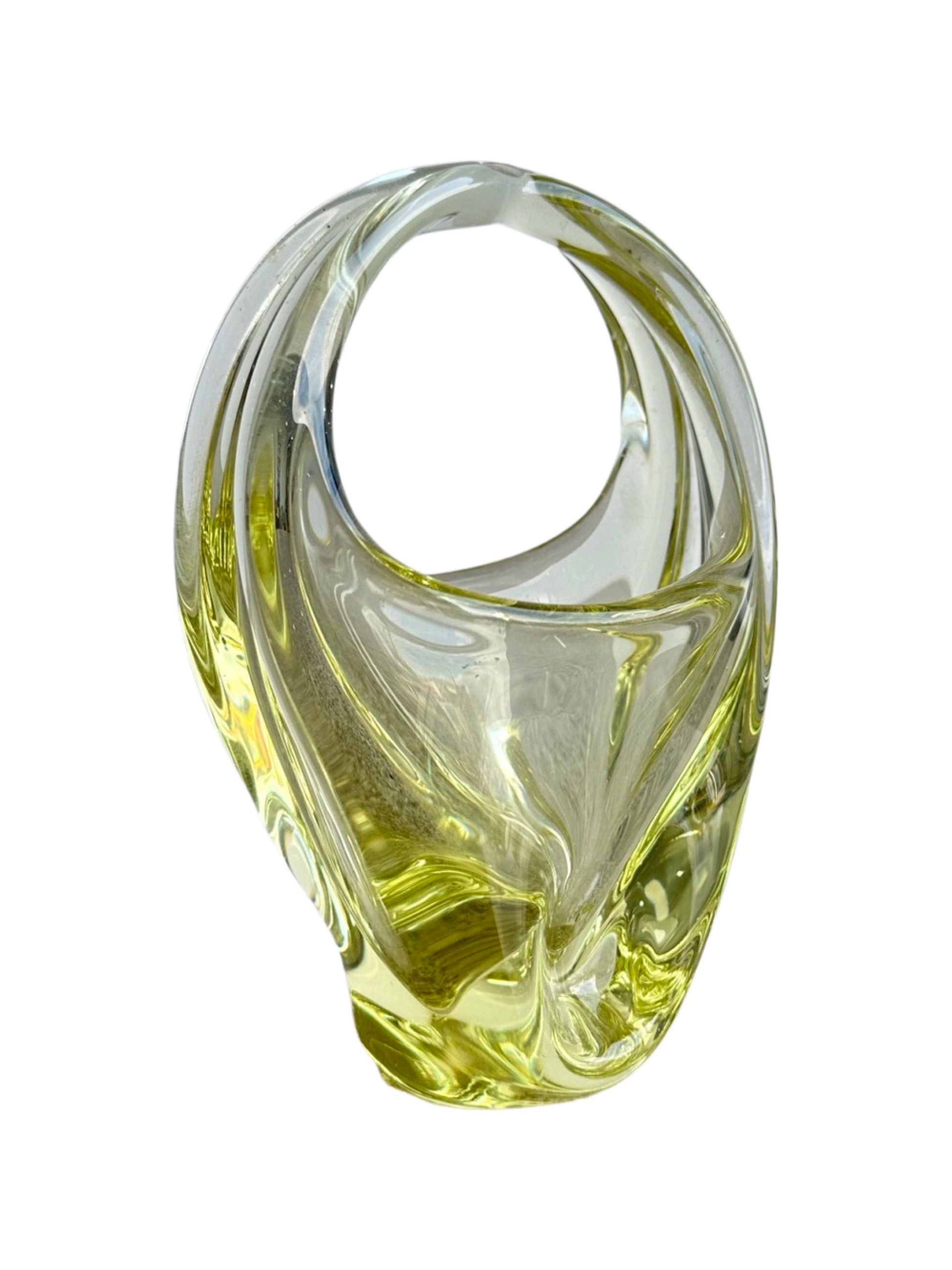 A Murano light yellow centrepiece basket made of glass, with a smooth surface and no visible contents.