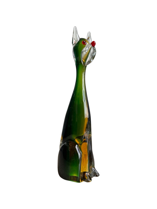 A green Murano glass sculpture of a dog, with a clear glass body and colored glass details.