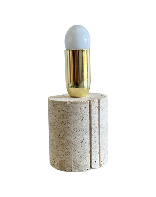 A Fratelli Mannelli round travertine and brass table lamp from the 1960s with a cylindrical shade removed, displaying the bulb and the brass details on the base.