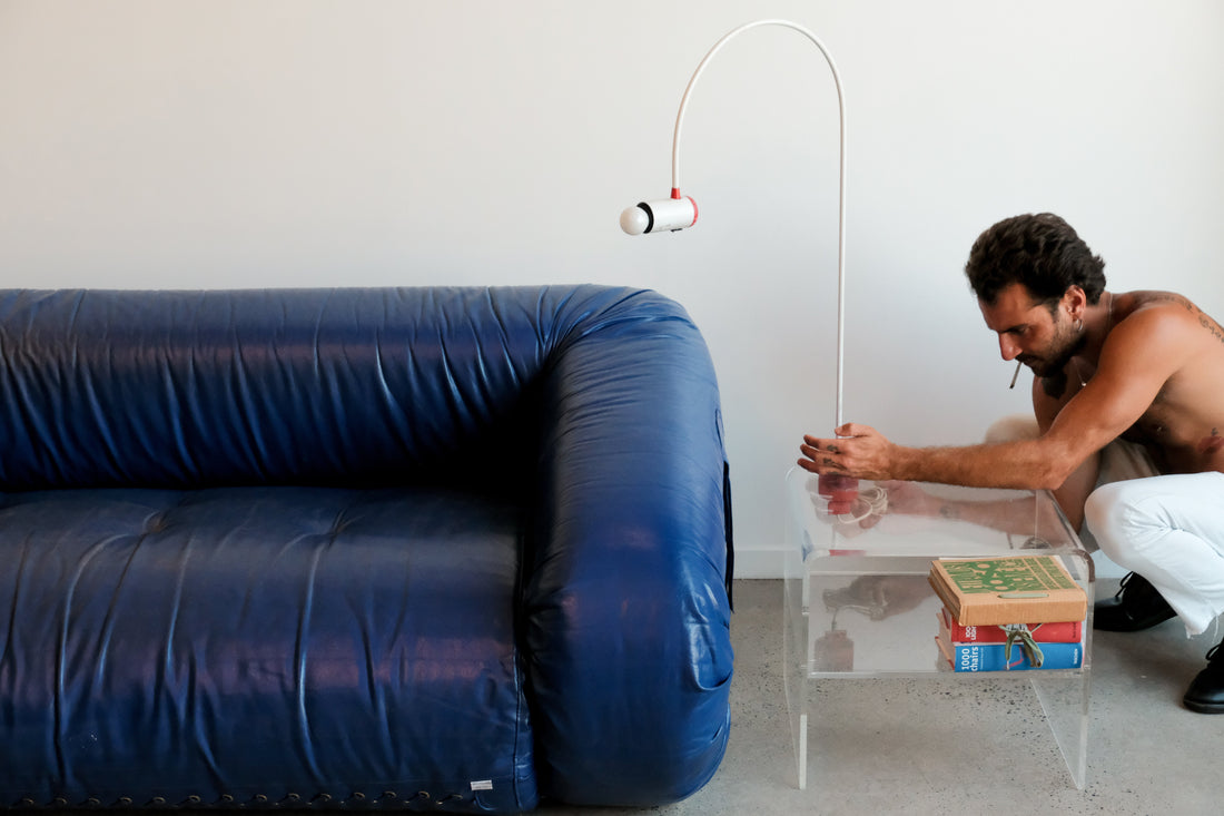 anfibio sofa with light and modern side table