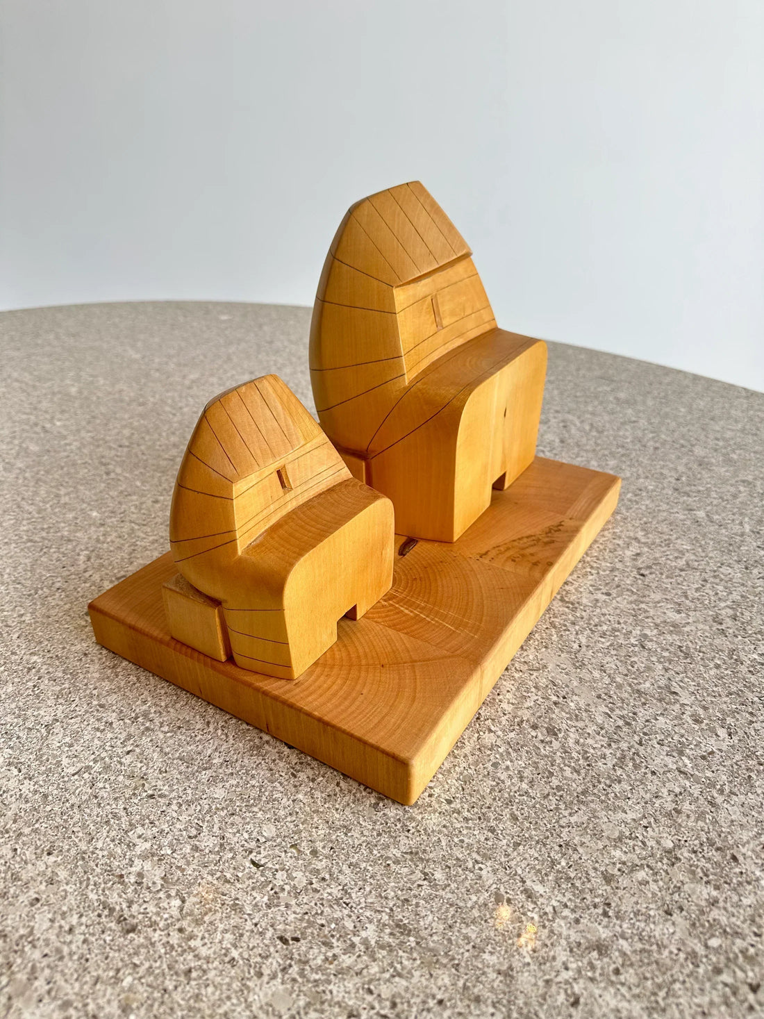 wooden sculpture on a marble table