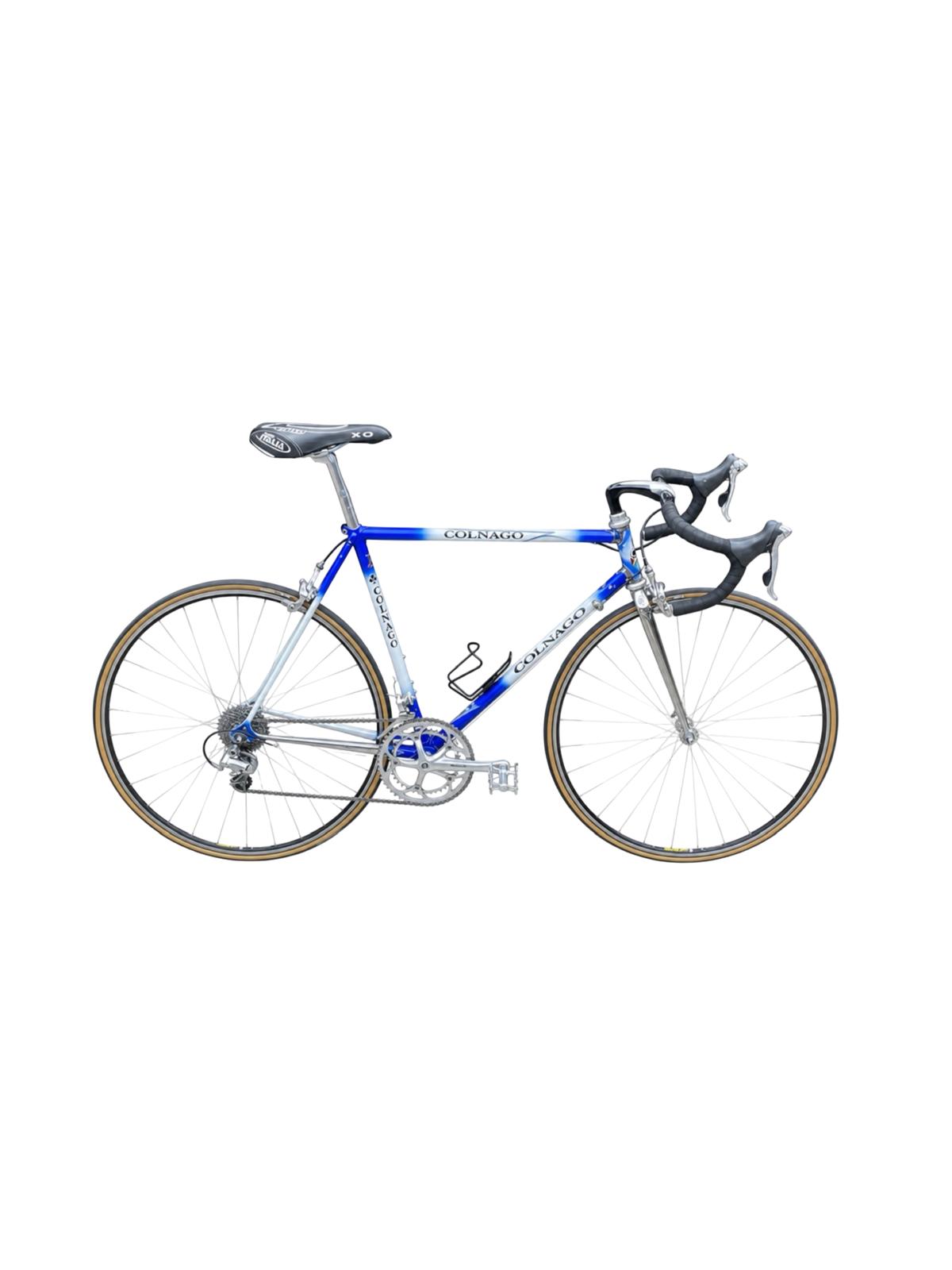A vintage road bicycle with a blue and silver frame, black drop handlebars, and brown tires, shown against a plain white background.