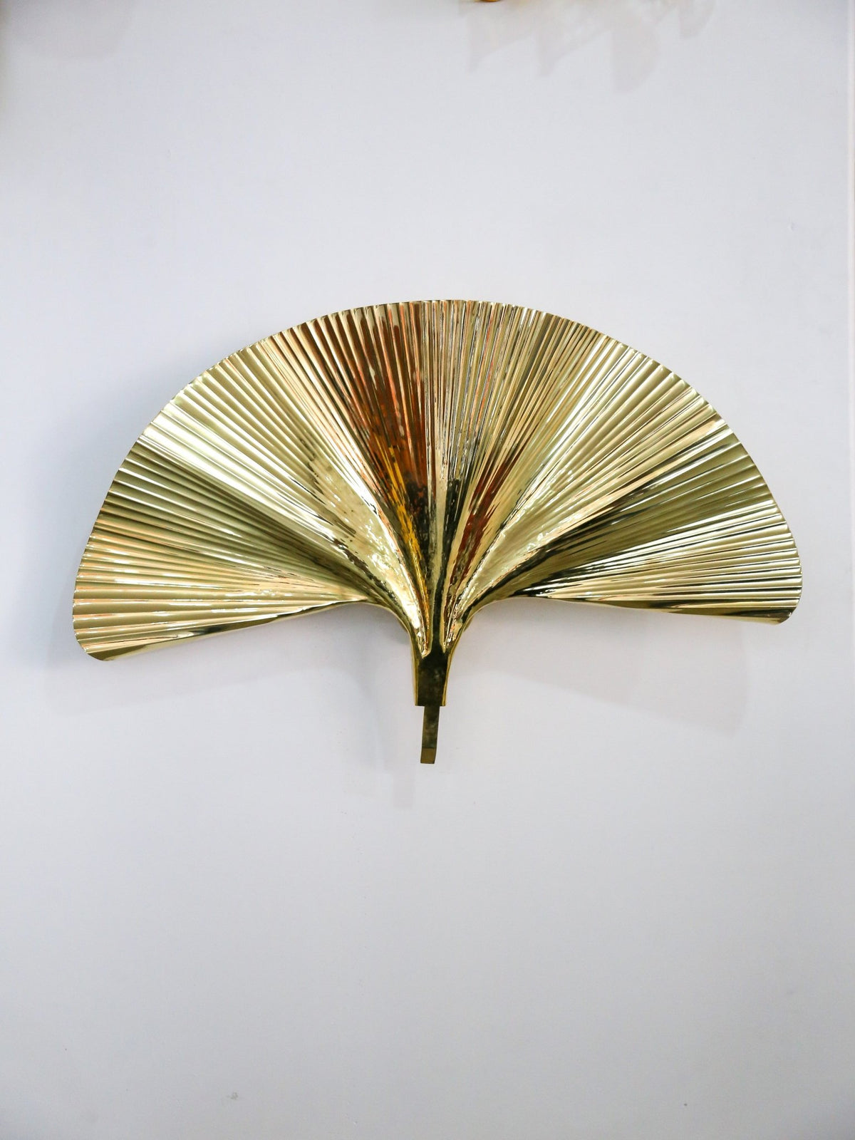 Gold leaf wall decor on a white background