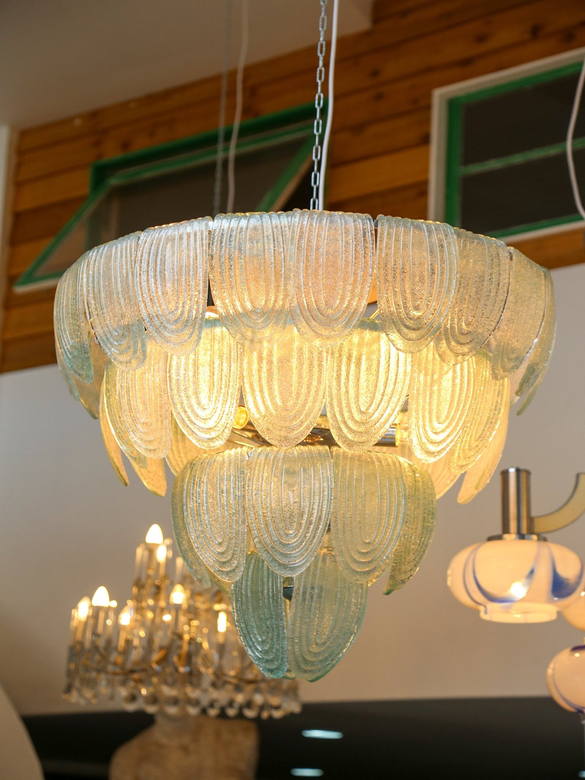 Decorative chandelier with a wooden wall background