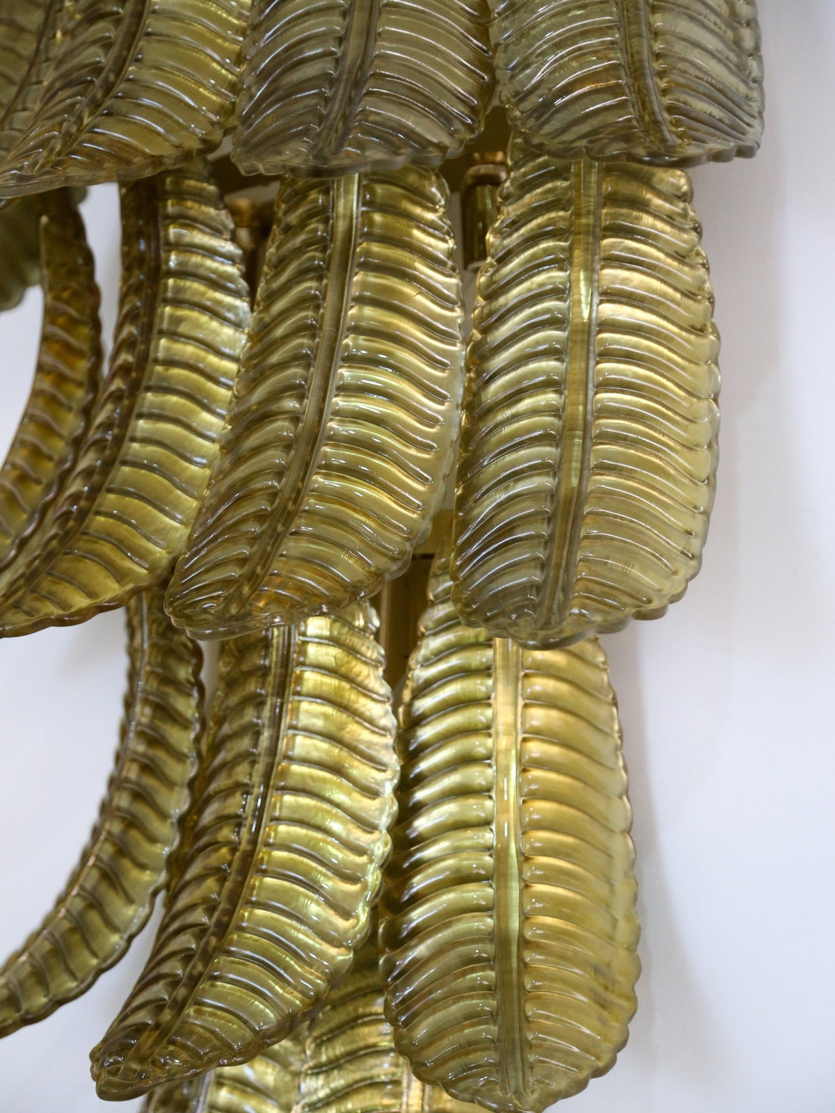 Gold leaf decorative wall piece on a white background