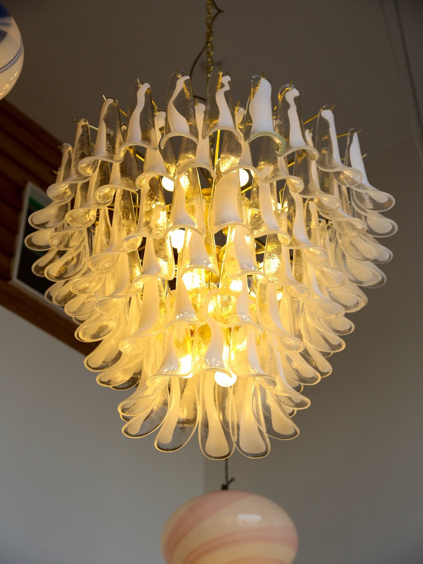 Decorative chandelier with glass elements on a ceiling
