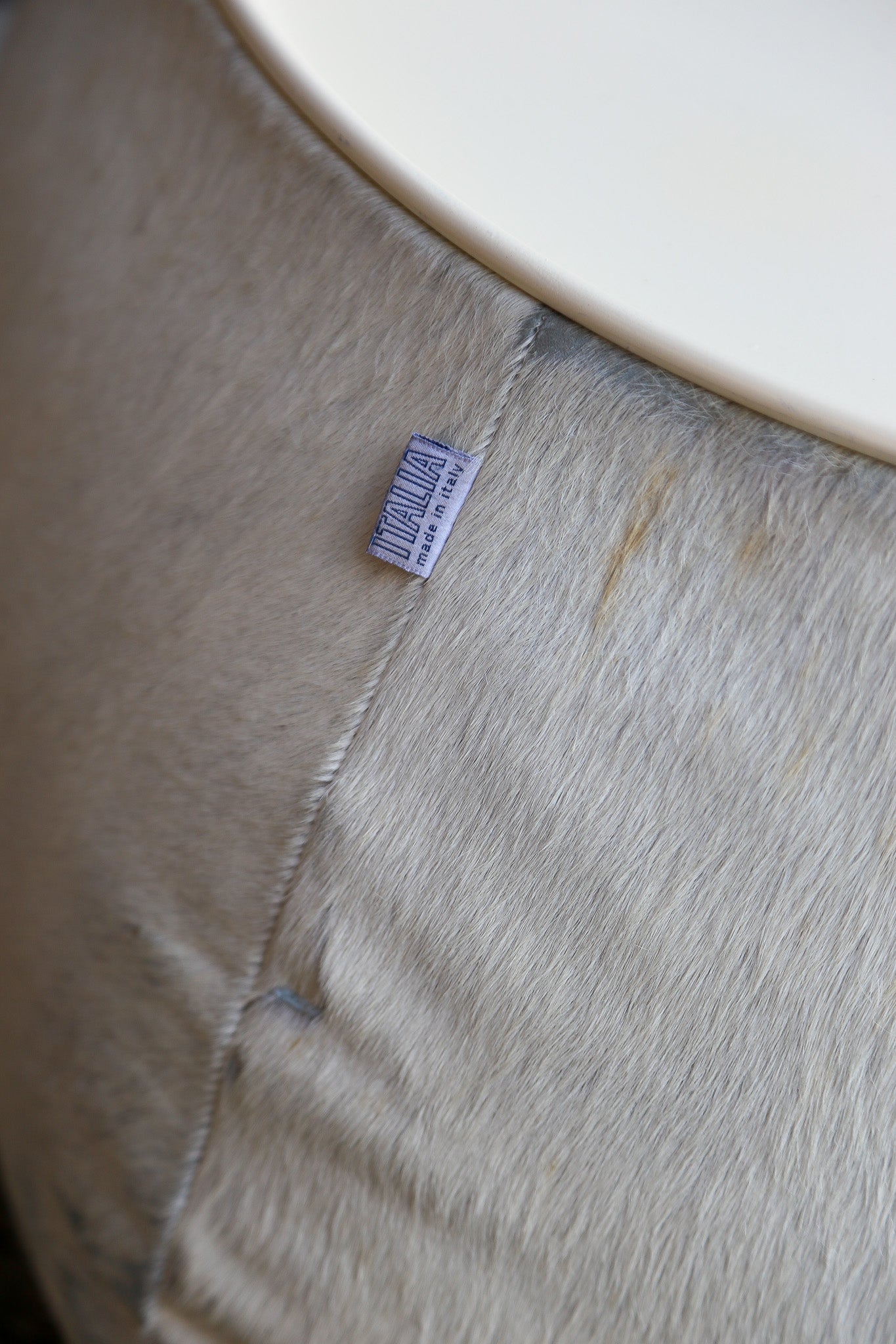 Close-up of a label on a piece of fabric with a white background