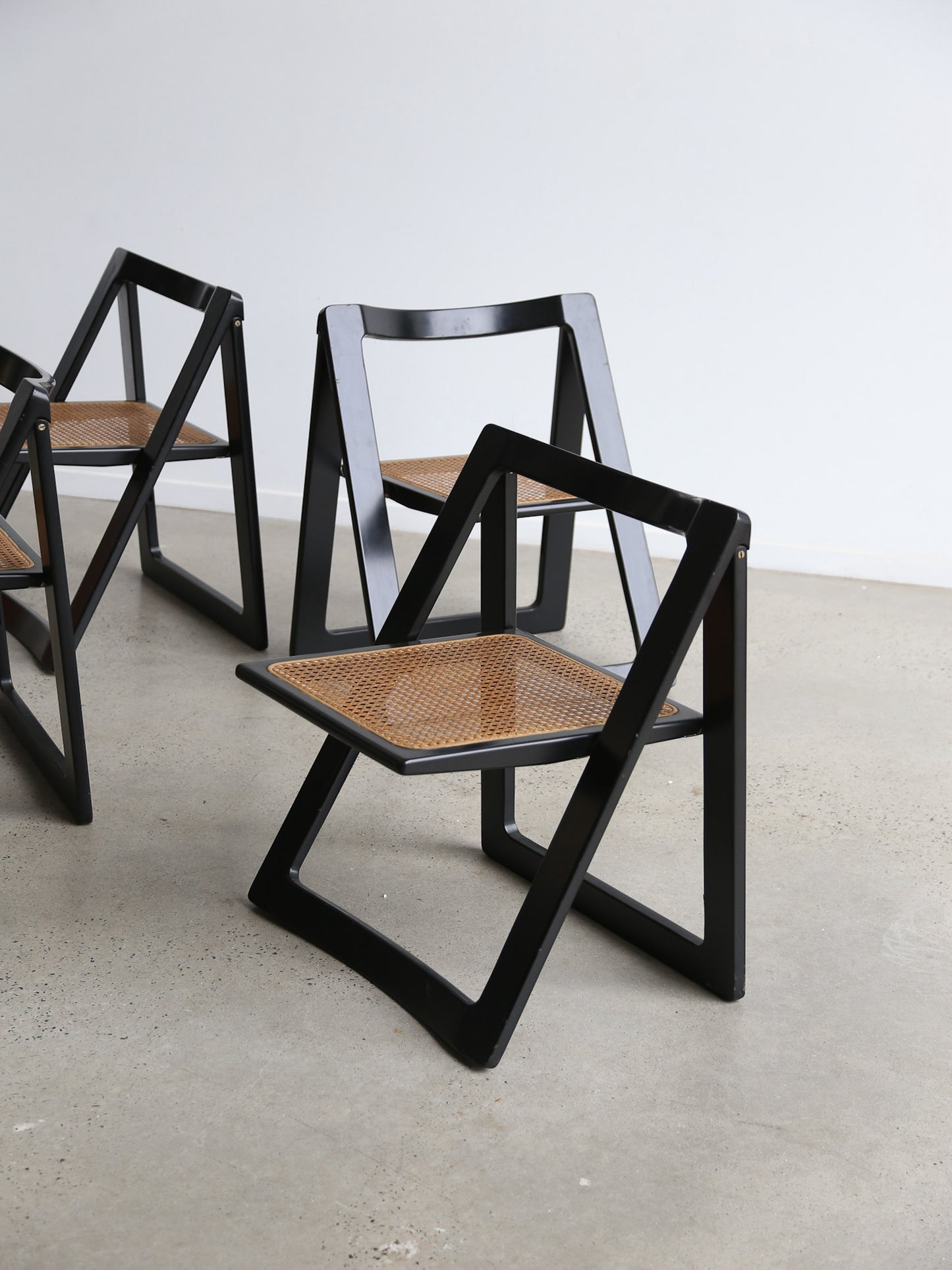 Trieste Set of Four Black Lacquered Folding Chairs by Jacob & D'aniello for Bazzani