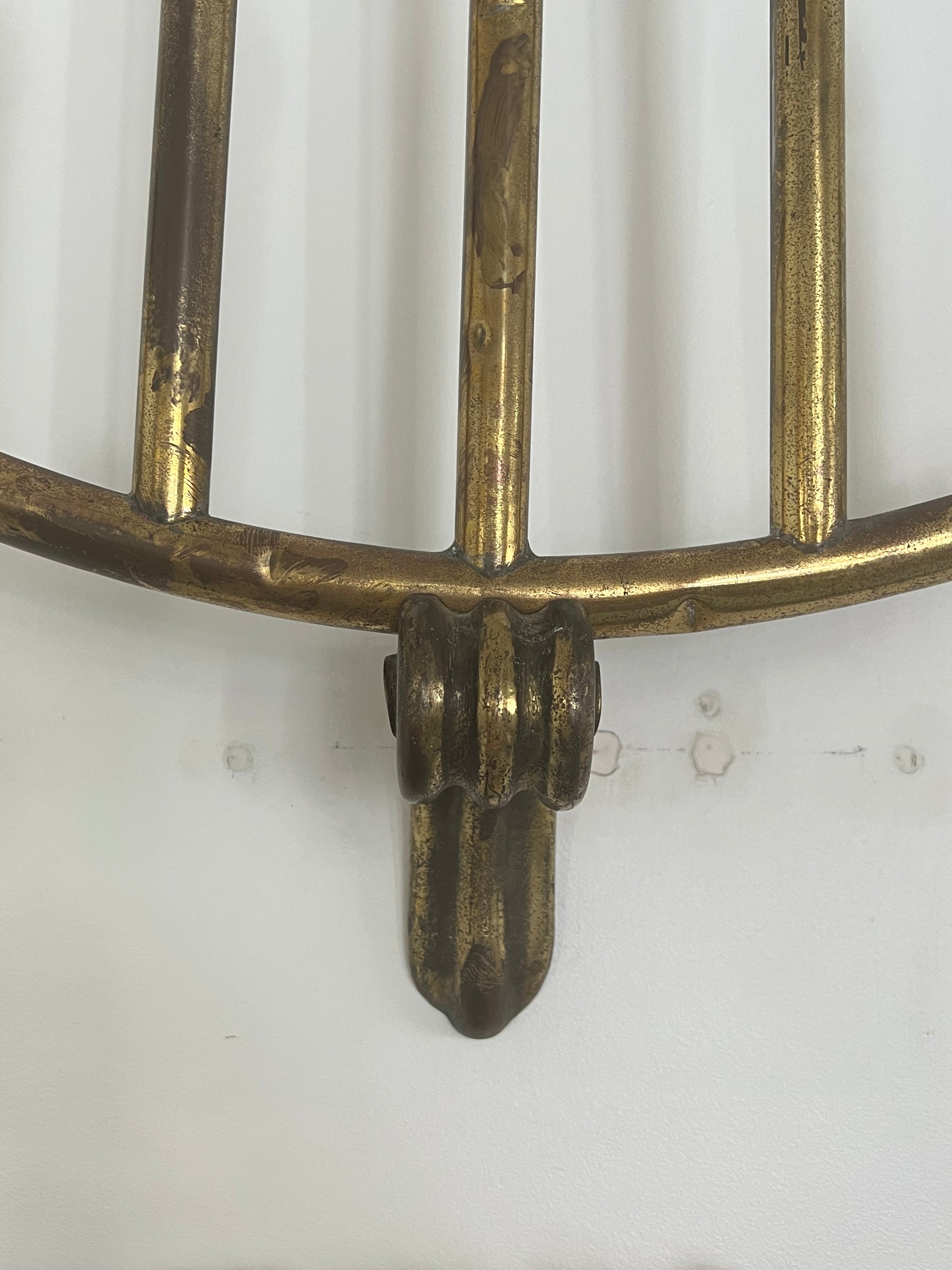 wall light with five bulbs over a white background