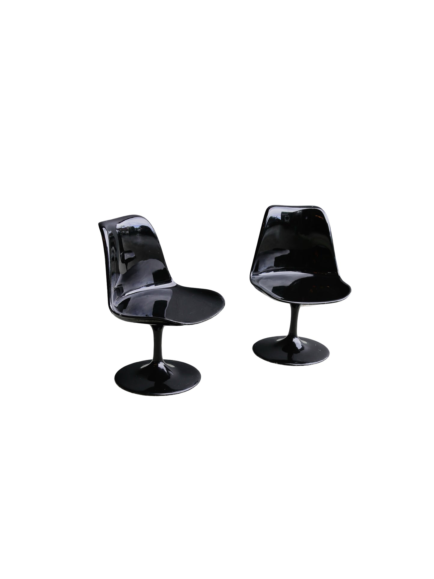 Two black chairs on a white background
