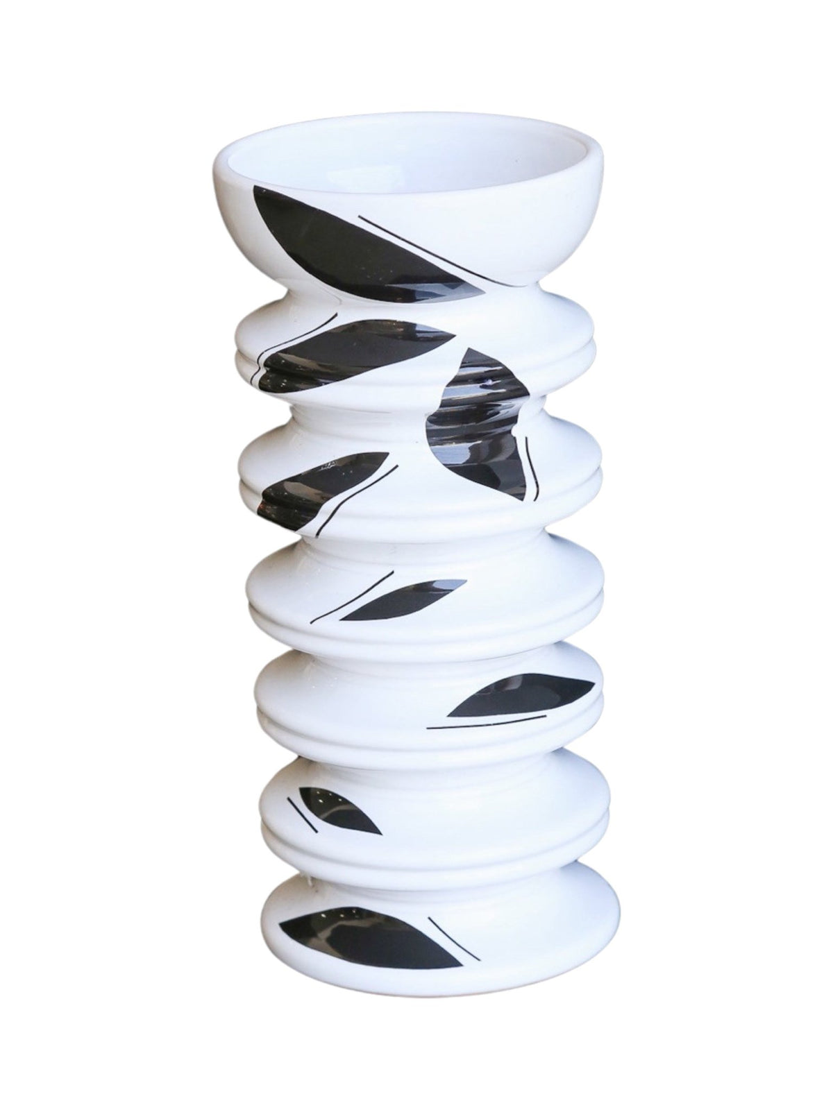 White vase with black spiral patterns on a white background