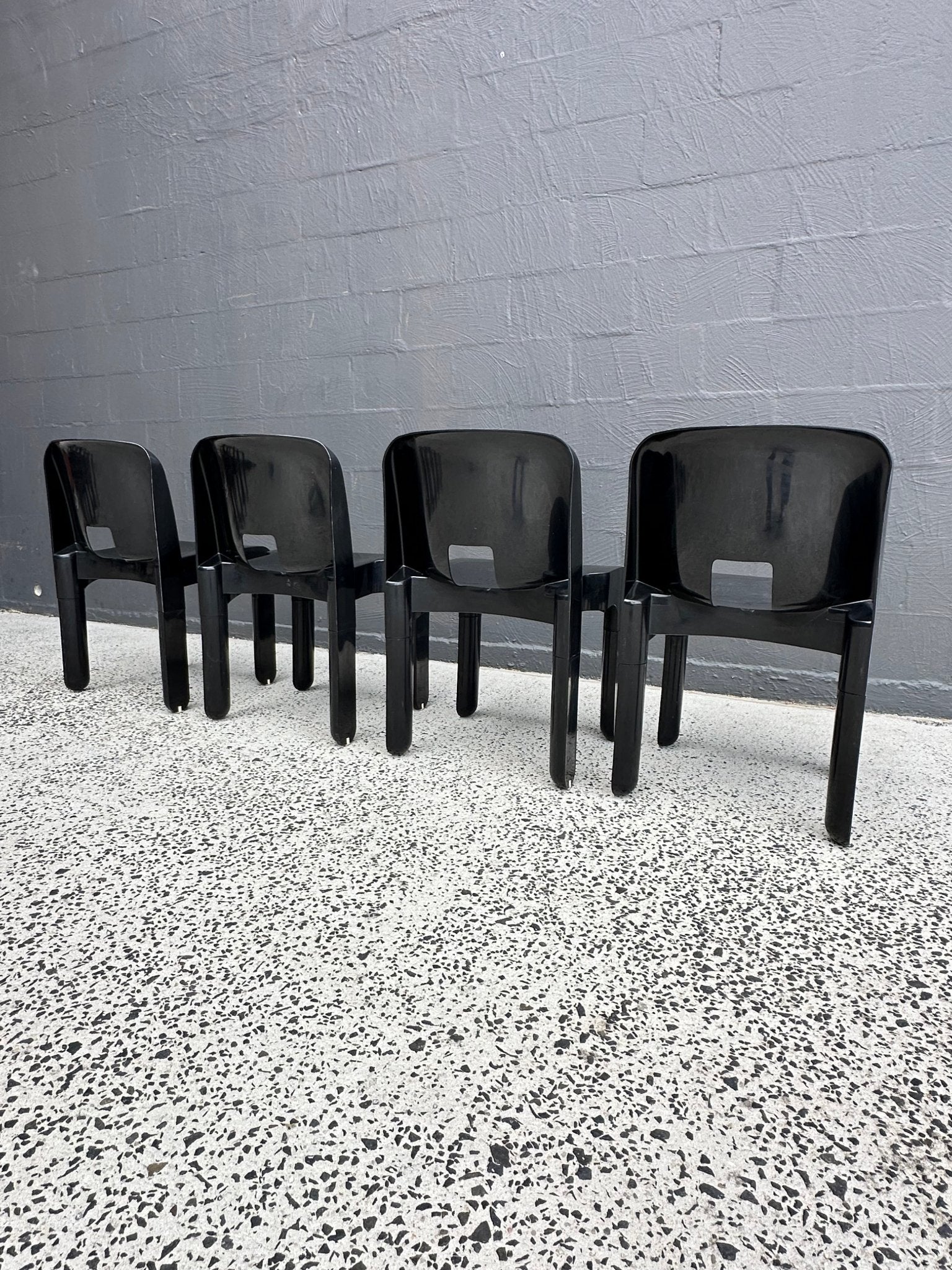 Joe Colombo for Kartell Universale Black Plastic Dining Chairs Set of Eight - Lumini Collections