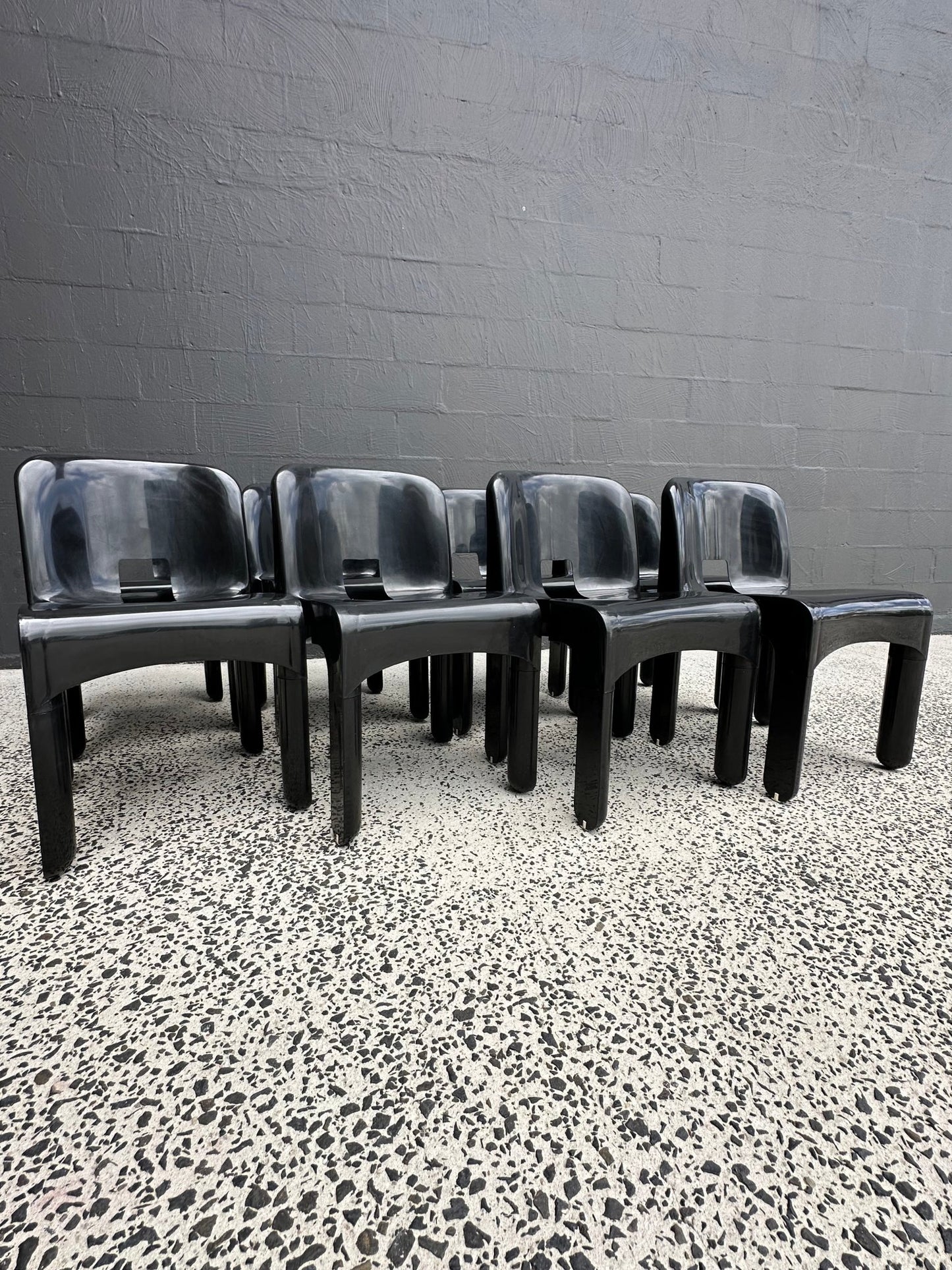 Joe Colombo for Kartell Universale Black Plastic Dining Chairs Set of Eight - Lumini Collections