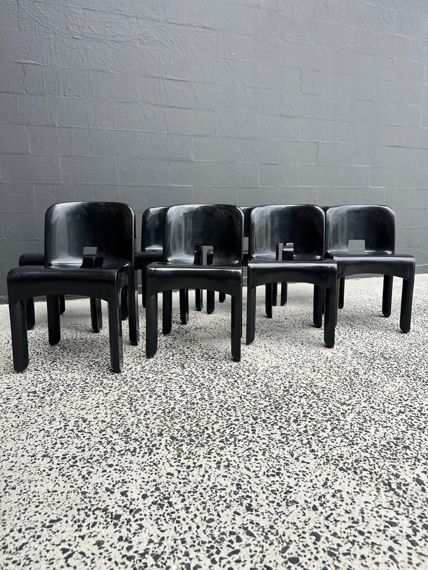 Joe Colombo for Kartell Universale Black Plastic Dining Chairs Set of Eight - Lumini Collections