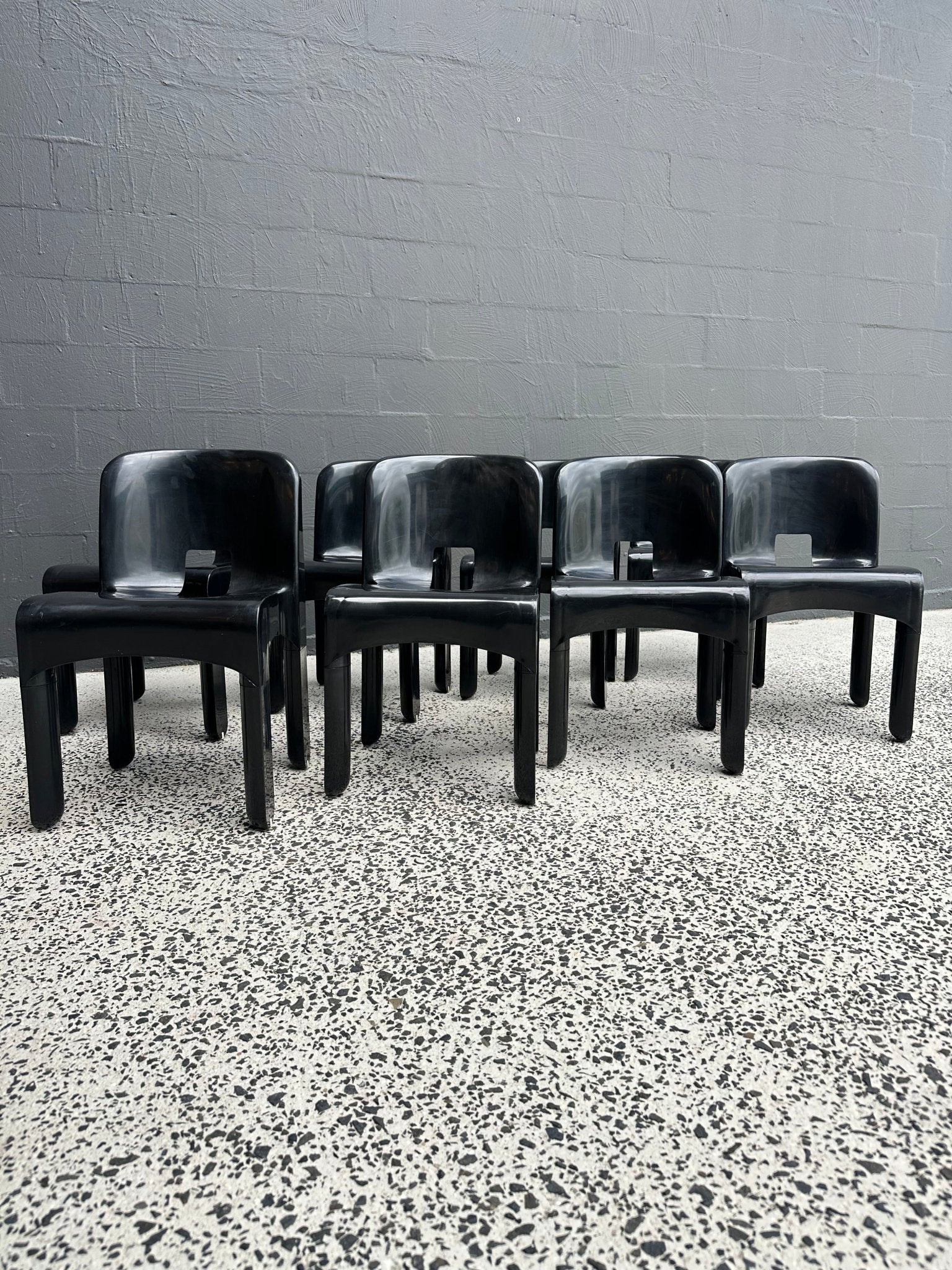 Joe Colombo for Kartell Universale Black Plastic Dining Chairs Set of Eight - Lumini Collections