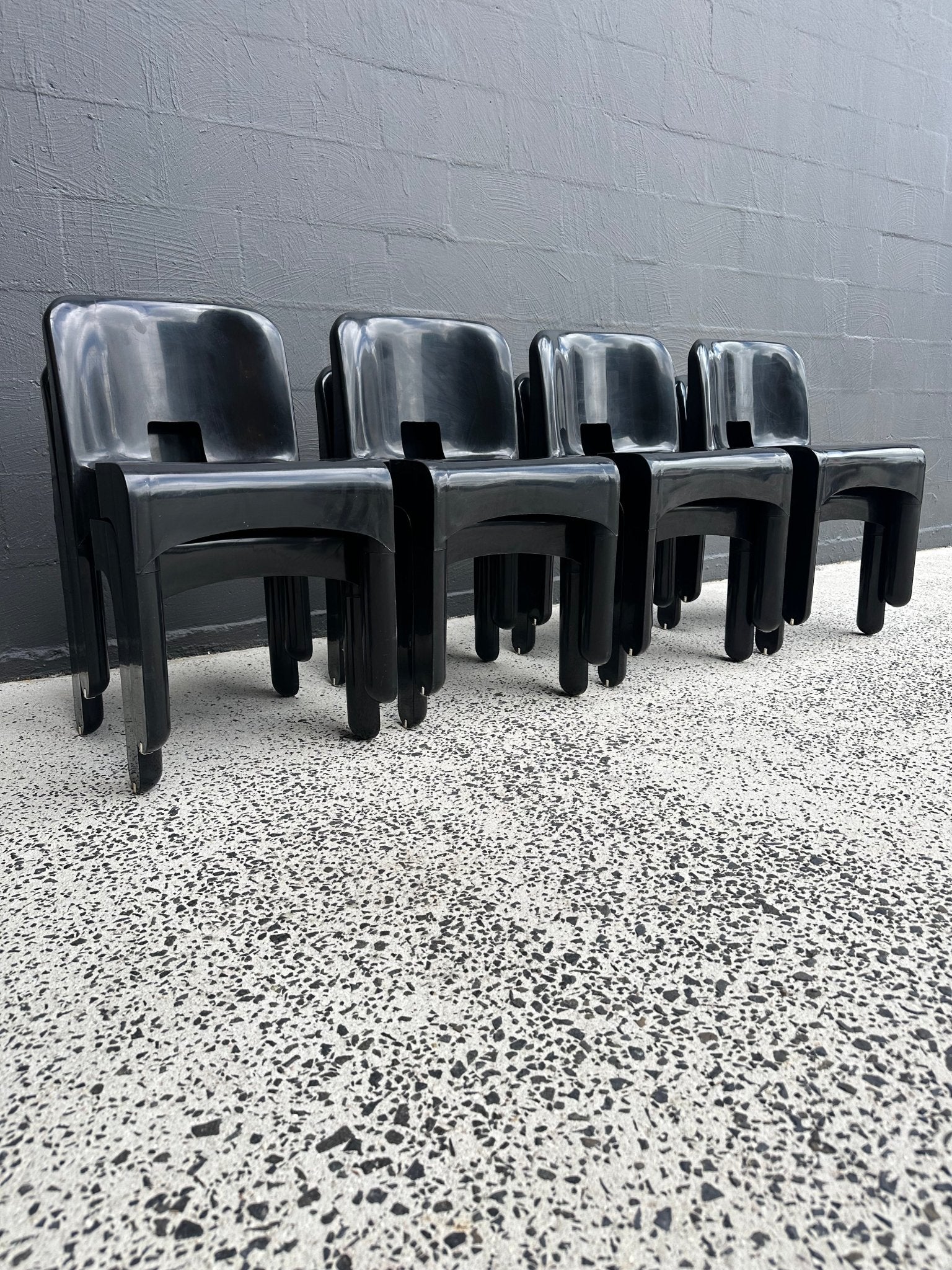 Joe Colombo for Kartell Universale Black Plastic Dining Chairs Set of Eight - Lumini Collections