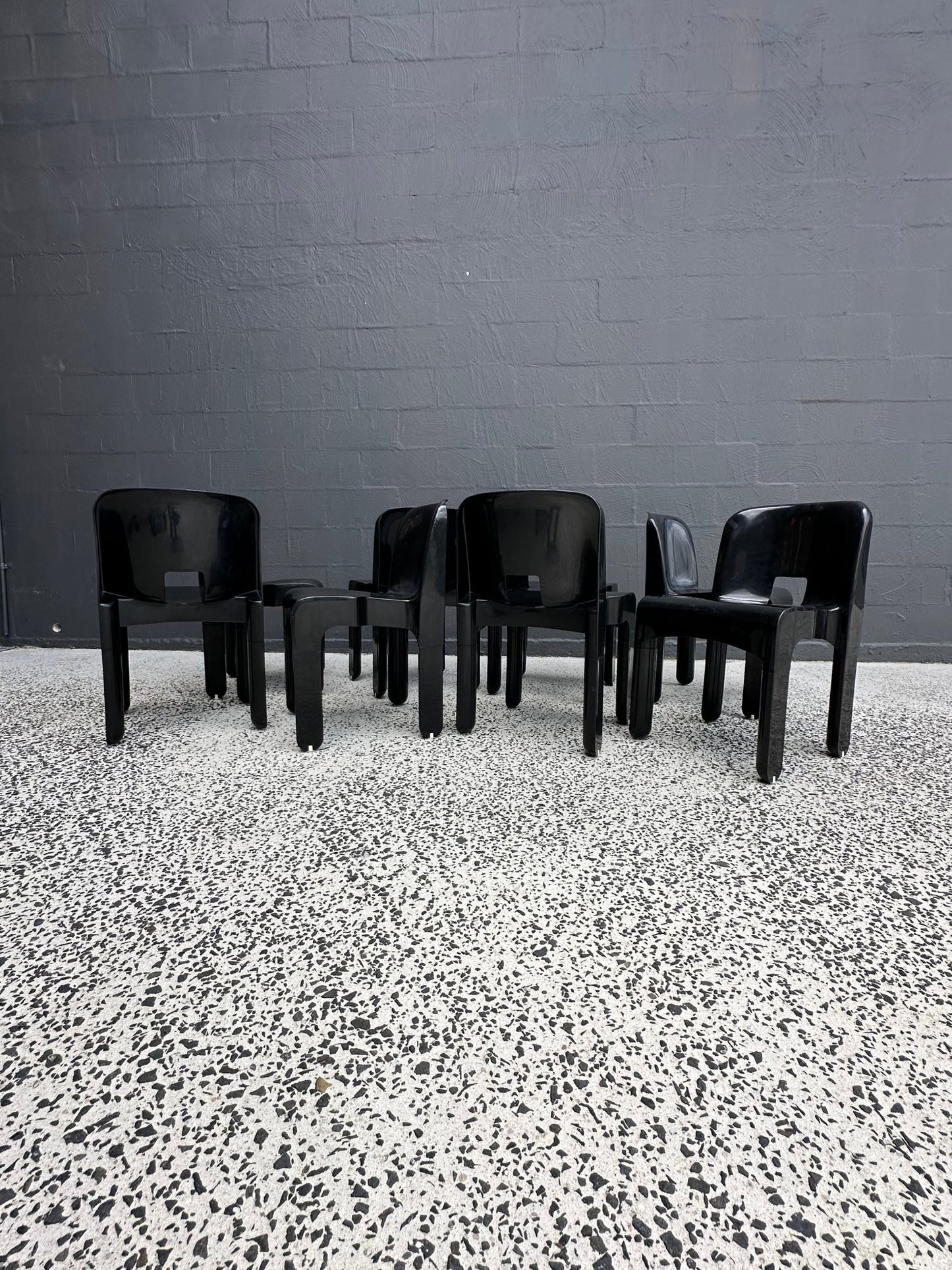 Joe Colombo for Kartell Universale Black Plastic Dining Chairs Set of Eight - Lumini Collections
