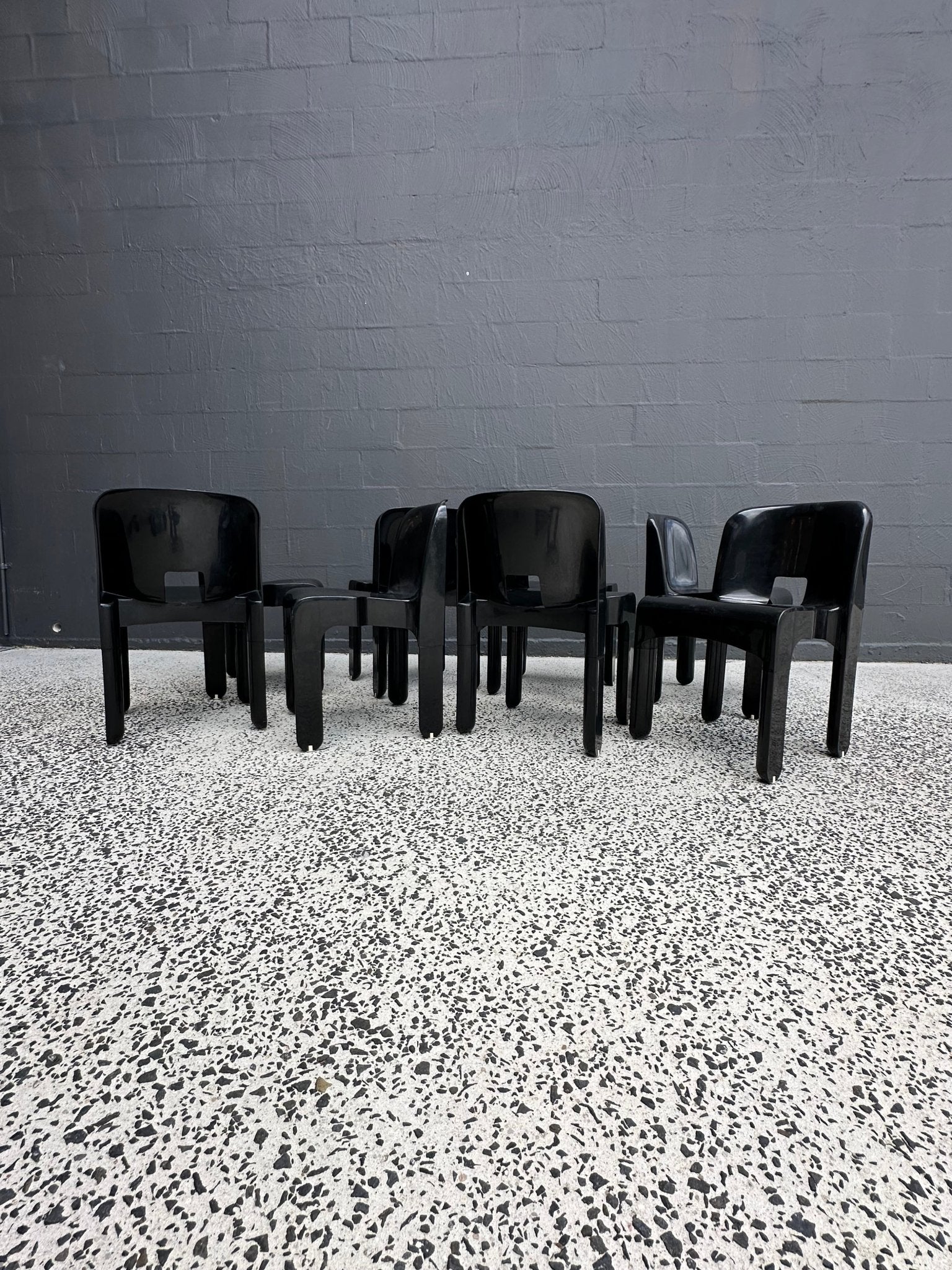Joe Colombo for Kartell Universale Black Plastic Dining Chairs Set of Eight - Lumini Collections
