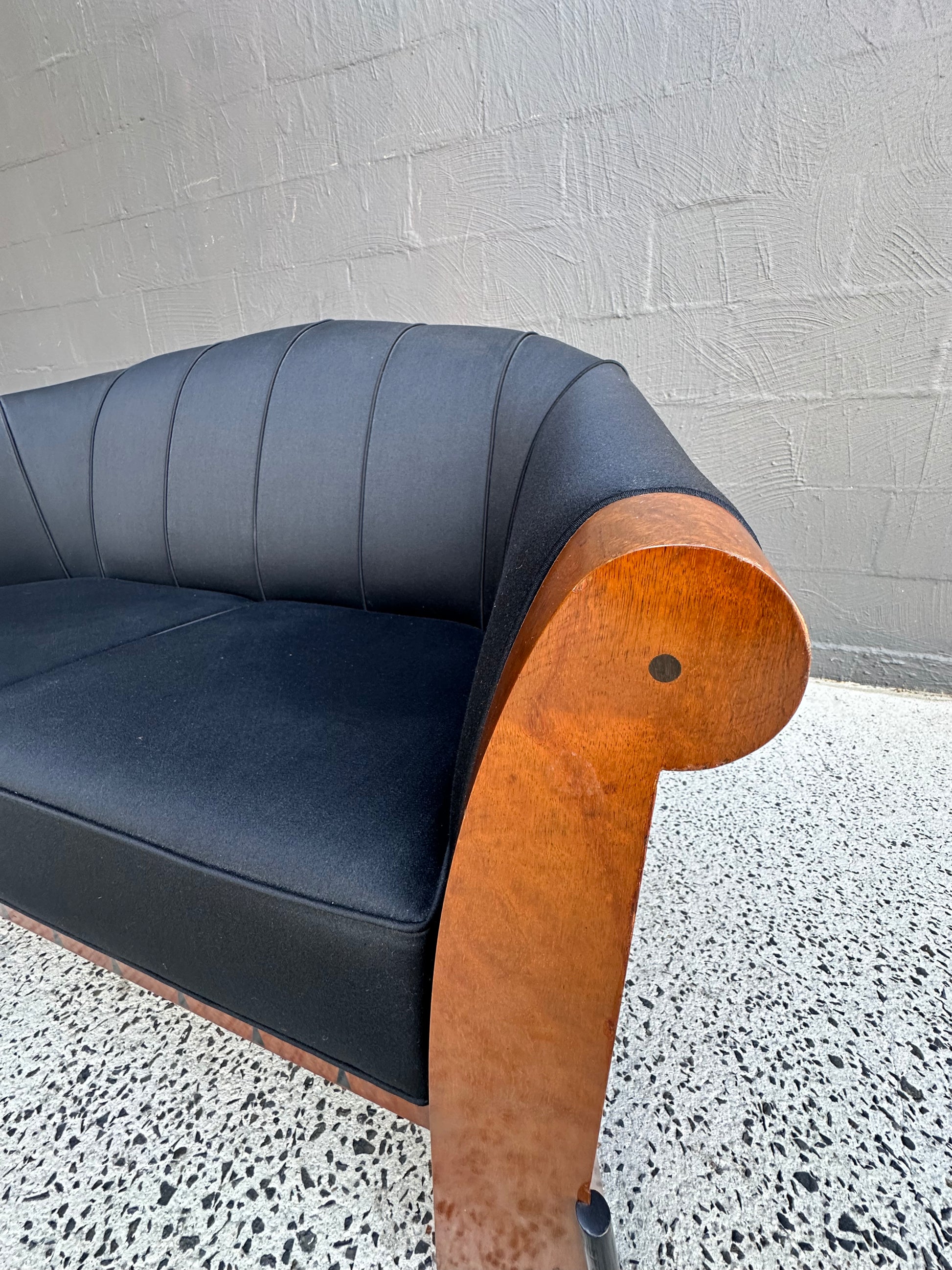 Side angle of rare Michael Graves sofa, postmodern Italian design, 1980s, birdseye maple with original black fabric