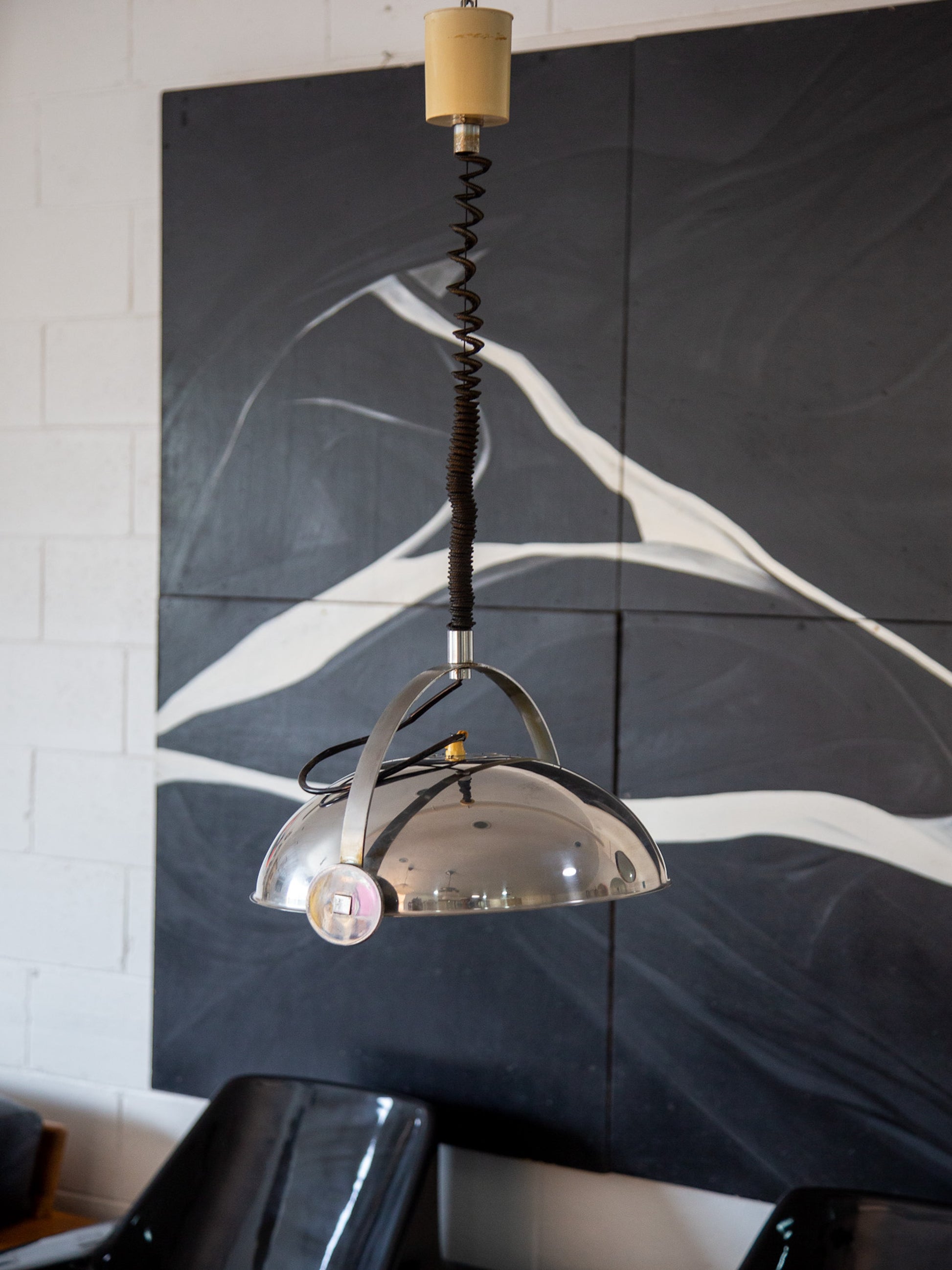 Italian midcentury pendant light by Reggiani S.p.A suspended on adjustable cord, styled in modern interior