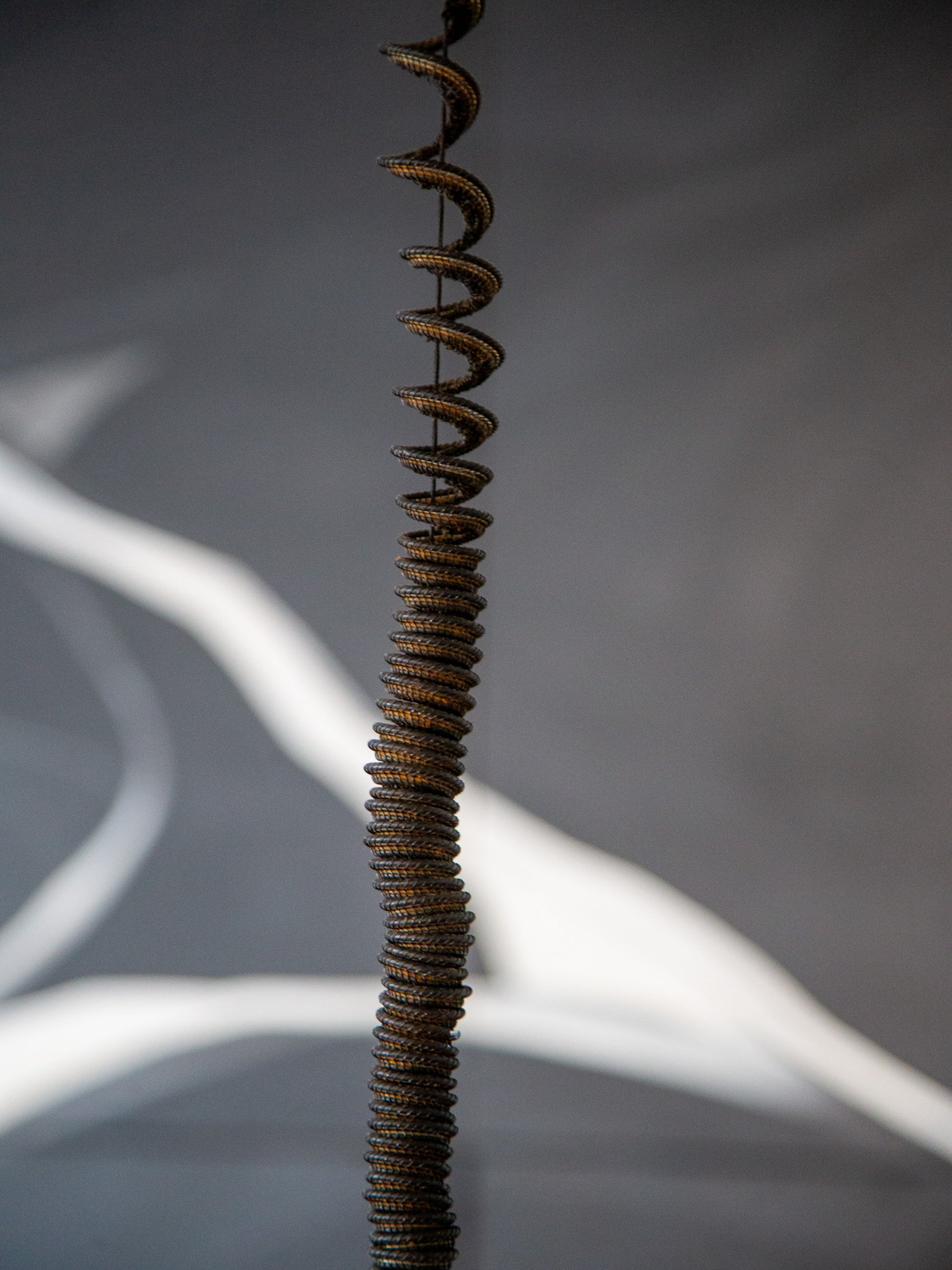 Coil cord detail of vintage Goffredo Reggiani pendant light, showing 1960s space-age industrial design
