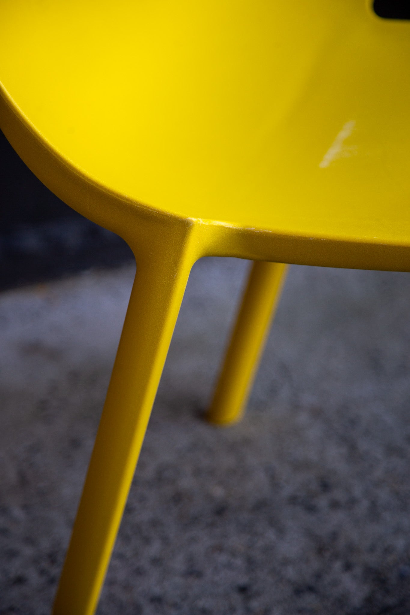 Close-up of a yellow chair with a blurred background